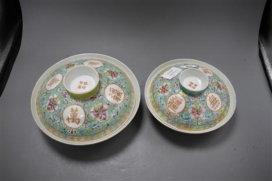 Two graduated Chinese famille rose bowls and cover, 20th century, each decorated with inscriptions and bearing red four character marks